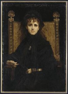 Portrait of Geneviève Straus, She is clothed in black and sits in a high-back wooden chair. She stares directly in front of her. Her left hand rests in her lap while her right lays on the chair's arm rest.