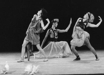 Wendy Perron and two other dancers, one man and one woman, in Ancient Greek-inspired costumes