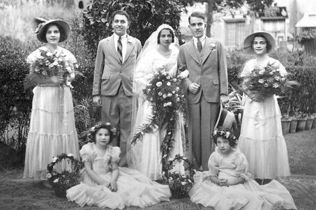 Outdoor portrait of a married couple and five members of the wedding party