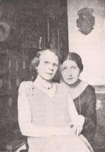 Black and white historical photograph of two women seated