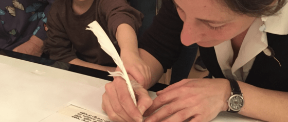 Julie Seltzer writing Torah with child