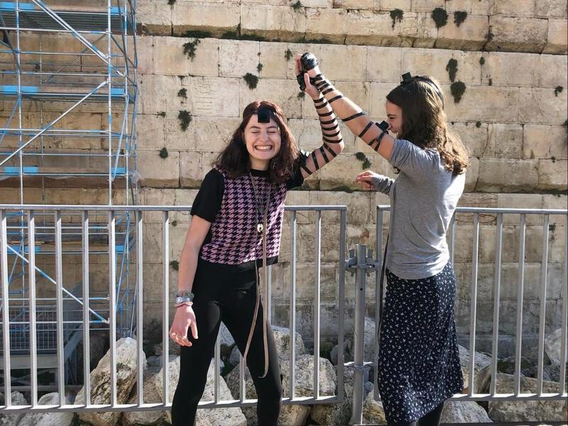 Maya Stutman-Shaw Wearing Tefillin with a Friend at the Western Wall