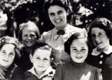 Andree Salom smiling with five young children