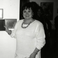 black and white photograph of a woman in a white dress