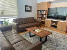 photograph of a living room with couches and table
