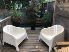 photo of two chairs on a deck