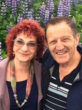 photograph of a woman with short curly red hair and a man with short brown hair