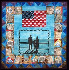 quilt with images of two adults and a child looking at the Statue of Liberty, under an American flag