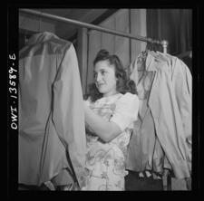 Jewish worker in a dress shop making blouses for the Women's Army Auxiliary Corps during WWII. 