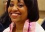 Close-cropped photo of Gina Drangel wearing a prayer shawl