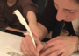 Julie Seltzer writing Torah with child