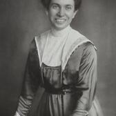 Josephine Levy-Rathenau standing and leaning against a table