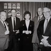 Hadassa Ben-Itto standding in between four men in suits