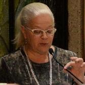 Judith Katzir speaking into a microphone