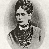 A portrait of Miriam Markel Mosessohn, wearing a dress with a frilled collar