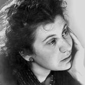 Portrait of Etty Hillesum, looking off-camera with her chin in her hand