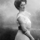 Studio portrait of Rahel Hirsch looking over her shoulder and smiling