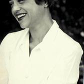 Wilma Shore looking off camera and laughing