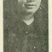 black and white newspaper photograph of a Black woman wearing a hat holding a fountain pen