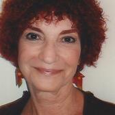 photograph of a woman with short curly red hair