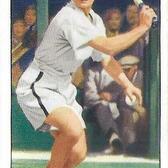 trading card with an image of a woman with short hair playing tennis in white tennis shorts, labeled "Ogden's Cigarettes" and "Miss Helen Jacobs"