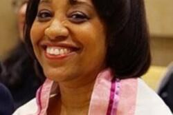 Close-cropped photo of Gina Drangel wearing a prayer shawl