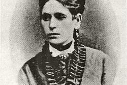 A portrait of Miriam Markel Mosessohn, wearing a dress with a frilled collar