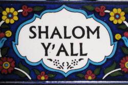 Colorful tile reading "Shalom Y'all"