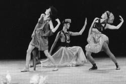 Wendy Perron and two other dancers, one man and one woman, in Ancient Greek-inspired costumes