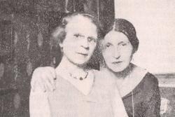 Black and white historical photograph of two women seated