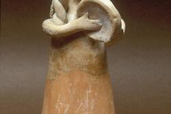 Figurine of woman playing drum