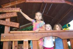 Dorrit Corwin in treehouse as a child