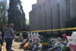 A couple hugs outside Tree of Life Synagogue