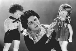 Beatrice Alexander Examining Dolls, circa 1920s