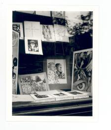 black and white photograph of the window display of a bookstore