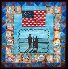quilt with images of two adults and a child looking at the Statue of Liberty, under an American flag