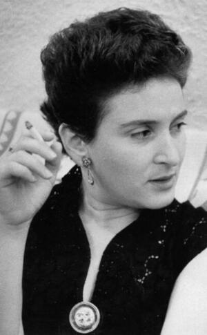 Adele Wiseman, looking off-camera and holding a cigarette