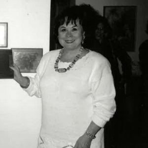 black and white photograph of a woman in a white dress