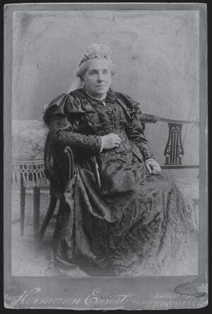 black and white historical photograph of a woman dressed in Victorian attire