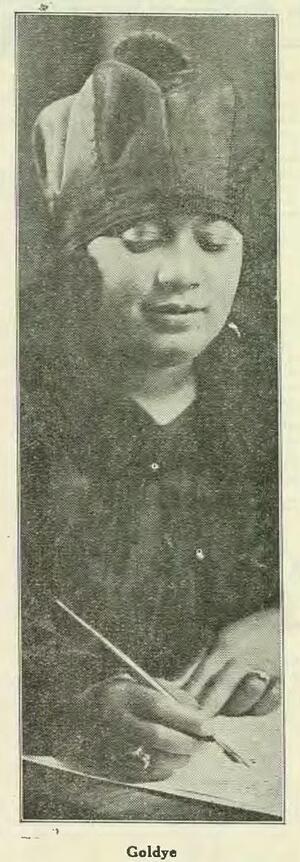 black and white newspaper photograph of a Black woman wearing a hat holding a fountain pen