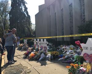 A couple hugs outside Tree of Life Synagogue