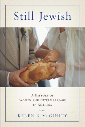 a book cover, featuring a picture of a man and woman tearing a loaf of challah