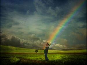 Woman in Field with Rainbow
