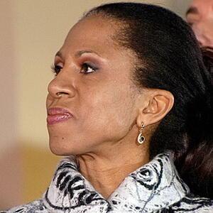 photograph of a light skinned Black woman looking off to the size with a pensive expression.
