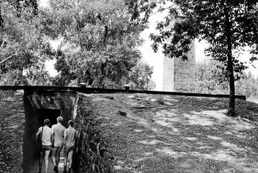 Three tourist enters a gas chamber at Auschwitz concentration camp