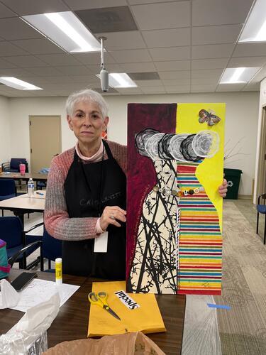 Carol Levitt with her art piece, "Hope"