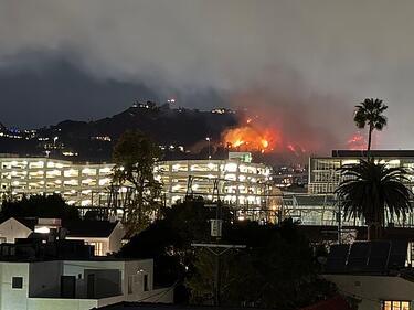 Sunset fire view from a rooftop in West Hollywood Los Angeles