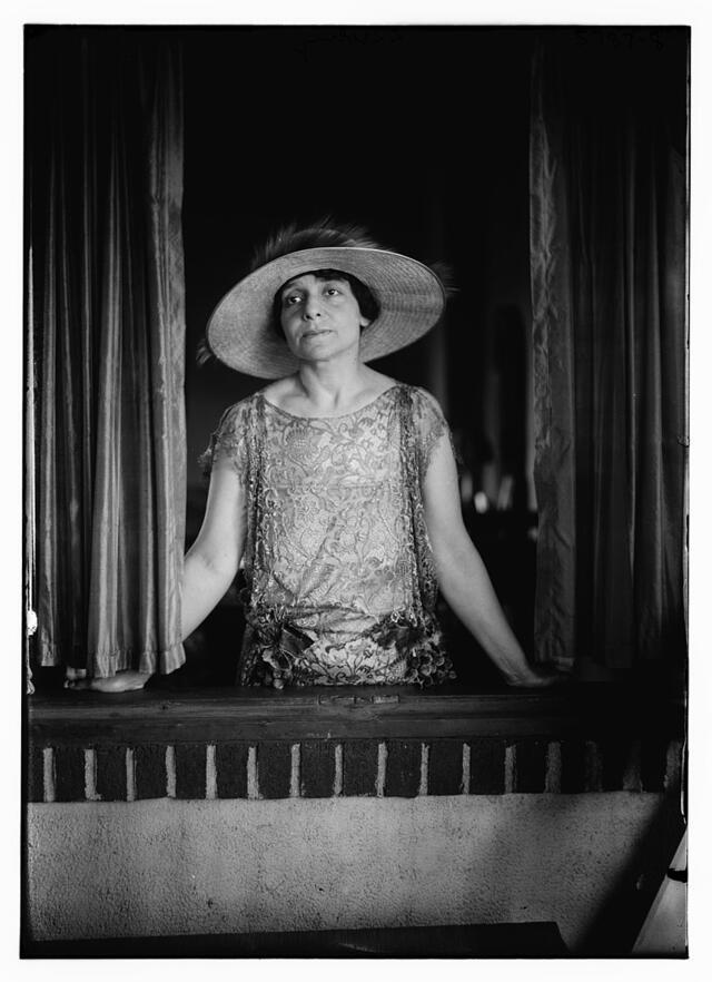 Estelle Liebling standing at an open window