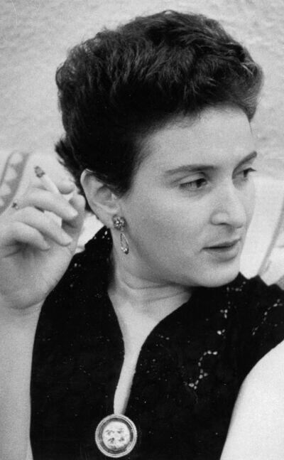 Adele Wiseman, looking off-camera and holding a cigarette