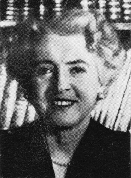 Cropped photo of Bertha Solomon in front of a bookshelf